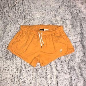 NIKE orange athletic shorts